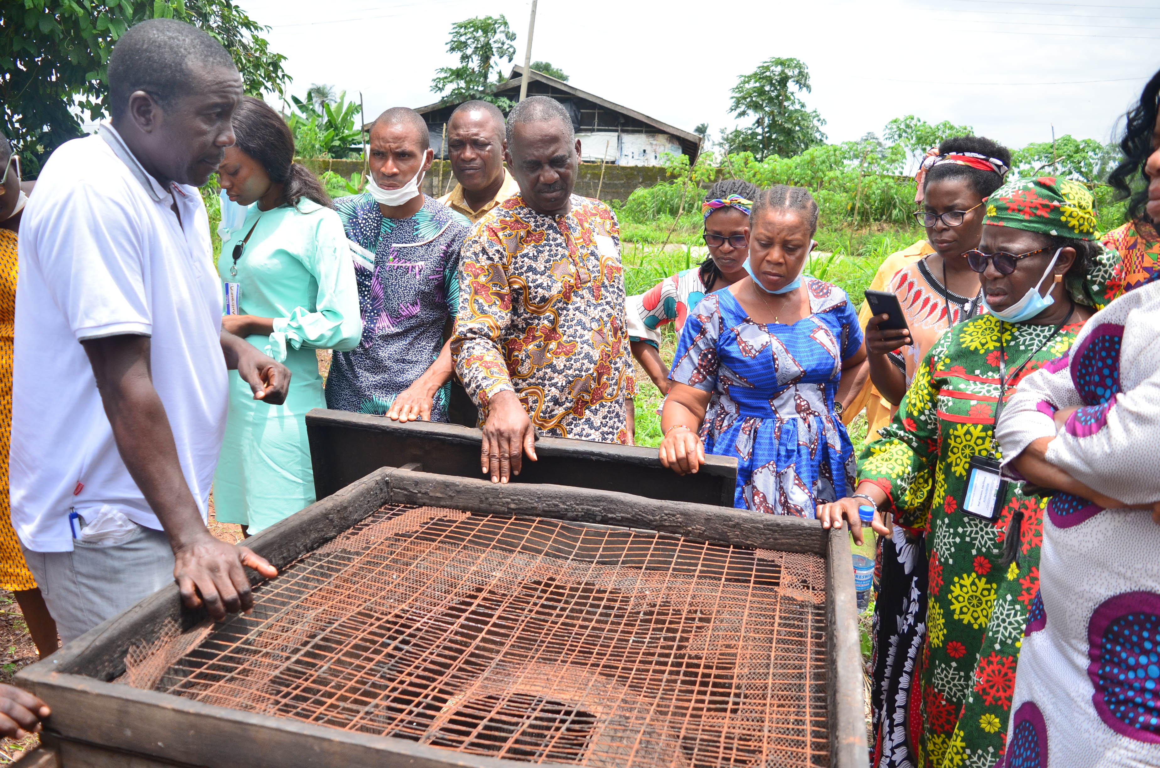 Here, the training participants are discussing common fish processing methods such as smoking fish. 