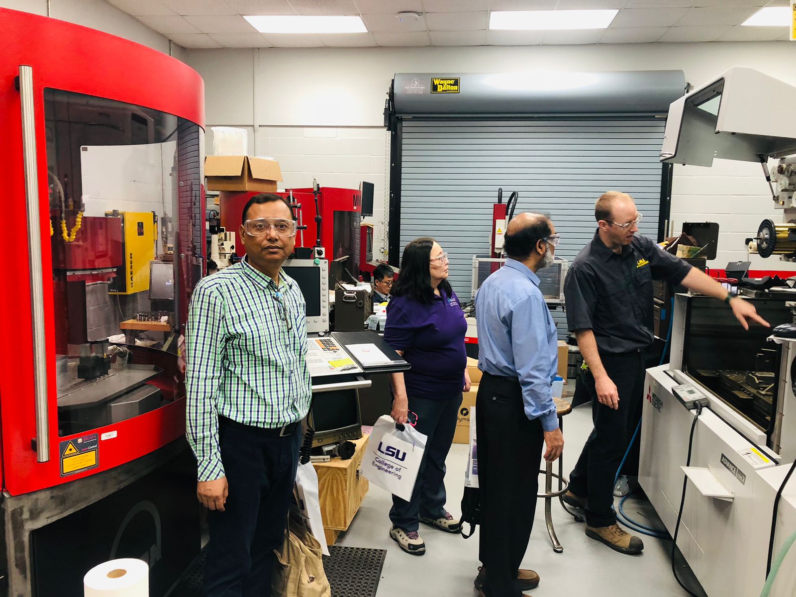 In this photo, personnel from LSU are showing the Fish Innovation Lab research team their mechanical engineering workshop. (Photos provided by Md. Rafiqul Islam Sarder and/or taken by Maria Teresa Gutierrez-Wing)