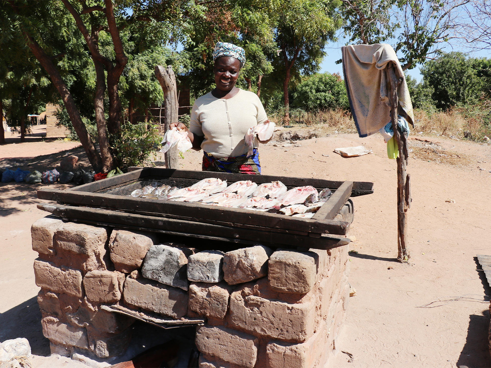 a lady cooking fish 