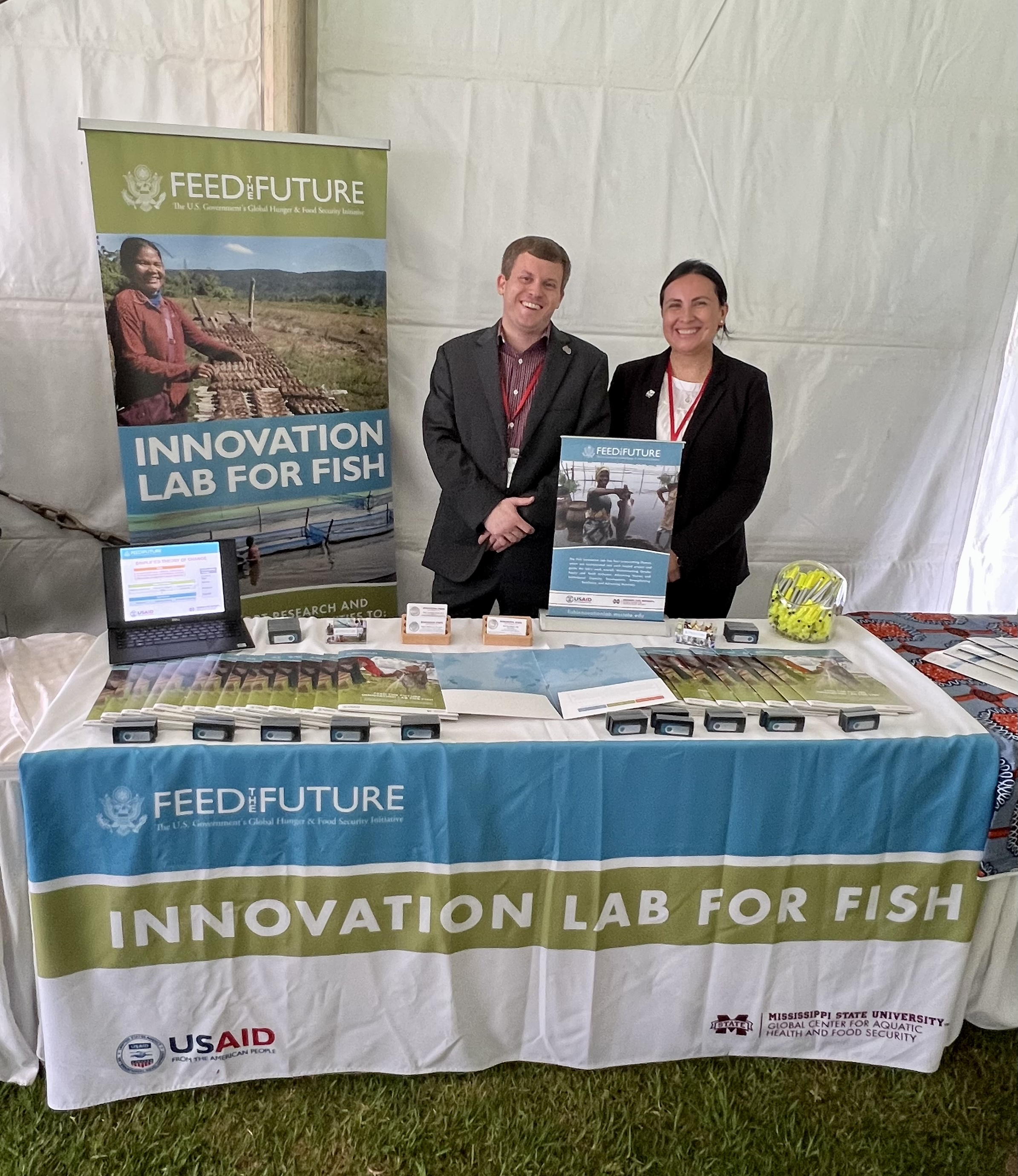 Stephen Reichley and Gina Rico Mendez standing at the Fish Innovation Lab booth